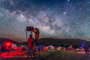 Observers at the Texas Star Party explore the wonders of the deep sky under the rising Milky Way, in May 2015. Sagittarius and Scorpius are in the background, with the centre of the Galaxy rising in the southeast. This is a single 30-second exposure at f/2 with the 24mm lens and Canon 5D MkII at ISO 4000.