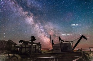 A nightscape of antique farm combines illuminated by starlight, with the Milky Way behind. The galactic centre area of Sagittarius and Scorpius lie to the south, with Saturn the brightest object at right. I shot this at the Visitor Centre at the Old Man on His Back Conservation Area in southwest Saskatchewan. The sky is a single 30-second exposure at f/2.8 with the 24mm lens and Canon 5D MkII at ISO 6400. The ground comes from a stack of 8 exposures to smooth noise, all part of a time-lapse/star trail sequence.