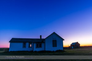 The waxing crescent Moon and Venus (above) over the old farm house at the Visitor Centre at the Old Man on His Back Natural and Historical Conservation Area in southwest Saskatchewan, May 20, 2015, on a very clear night. The old house was the original house lived in by the Butala family who settled the area in the 1920s. This is a single exposure taken as part of an 850-frame time-lapse sequence with the 14mm Rokinon lens and Canon 60Da camera.