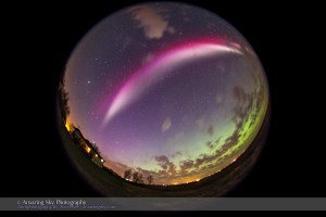A strange red/magenta auroral arc overhead across the sky, with a more normal green diffuse glow to the north, as seen on May 10, 2015. The Big Dipper is overhead in the centre of the frame, Jupiter is at left in the west and Arcturus is at top to the south. I shot this from home, using an 8mm fish-eye lens to take in most of the sky, with the camera looking north. It is part of a 170-frame time-lapse sequence. Exposure was 32 seconds at f/3.6 and ISO 3200 with the Canon 6D.