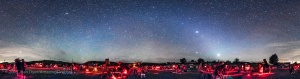 A 360° panorama of the upper field of the Texas Star Party at the Prde Ranch near Fort Davis, TX, May 13, 2015, taken once the sky got astronomically dark. The panorama shows the field of telescopes and observers enjoying a night of deep-sky viewing and imaging. Venus is the bright object at right of centre and Jupiter is above it. The Zodiacal Light stretches up from the horizon and continues left across the sky in the Zodiacal Band to brighten in the east (left of centre) as the Gegeneschein. I shot this with a 14mm lens, oriented vertically, with each segment 60 seconds at f/2.8 and with the Canon 5D MkII at ISO 3200. The panorama is made of 8 segements at 45° spacings. The segments were stitched with PTGui software.