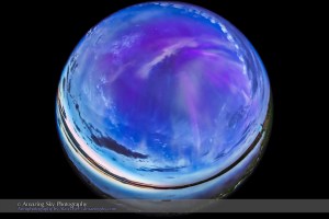 The all-sky aurora of June 22, 2015, during a level 7 to 9 geomagnetic storm, as the display began already active in the darkening twilight of a solstice night. This is one frame from a 568-frame time-lapse, taken with the 8mm Sigma fish-eye lens at f/3.5 and with the Canon 6D, composed for projection in tilt-dome digital planetariums. I was on the south shore of Crawling Valley Lake and Reservoir in southern Alberta.