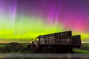 An aurora display on the night of June 7/8, 2015 from southern Alberta, with an old rustic farm truck as the foreground. This is a frame from a 450-frame time-lapse with the Nikon D750 at ISO 1600 and the Sigma 24mm lens at f/2.8, for 8 seconds each. The foreground is from a stack of 8 images adjacent in time to the sky image stacked in Mean mode for smoothing of noise.
