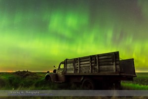 An aurora display on the night of June 7/8, 2015 from southern Alberta, with an old rustic farm truck as the foreground. This is a frame from a 450-frame time-lapse with the Nikon D740 at ISO 1600 and the Sigma 24mm lens at f/2.8, for 8 second each. The foreground is from a stack of 8 images adjacent in time to the sky image stacked in Mean mode for smoothing of noise.