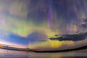 The all-sky aurora of June 22, 2015, during a level 7 to 9 geomagnetic storm, as the display began already active in the twilight of a solstice night. This is one frame from a 960-frame time-lapse, taken with the 15mm full-frame fish-eye lens at f/2.8 and with the Canon 60Da, looking north to the perpetual twilight of solstice. I was on the south shore of Crawling Valley Lake and Reservoir in southern Alberta.