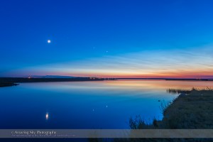 The evening planets of Venus (right) and Jupiter (left), to the right of the waxing crescent Moon on the evening of summer sosltice, June 21, 2015. The star Regulus is to the upper right of the Moon, between Jupiter and the Moon. The view is overlooking Crawling Lake in southern Alberta. This is an HDR stack of 5 exposures to retain detail in the bright twilight sky and the dark foreground.