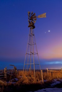 Venus and Jupiter behind old farm water pump windmill, taken March 12, 2012 near home on Glenmore Trail road east of Langdon. Car headlights provide the illumination. Taken with a Canon 5D MkII at ISO 400 and 16-35mm lens at f/4 and 26mm for 20 seconds. A mixture of twilight and light pollution on thin cluds provided the sky colours. Pleiades and Hyades also visible.