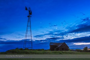 Venus (right) and Jupiter (centre), on June 12, 2015, as they are converging toward a close conjunction on June 30, 2015. The star Regulus is at left, left of the windmill. Photographed from an old farm yard north of Vulcan, Alberta. This is an HDR-stack of 3 exposures to record detail in the ground and sky. Shot with the Canon 60Da and 16-35mm lens.