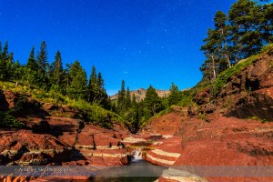 Cassiopeia and the northern stars over Red Rock Canyon in Waterton Lakes National Park, Alberta, with illumination from a waxing gibbous Moon. This is a composite of three 30-second exposures for the ground to smooth noise and one 30-second exposure for the sky, all with the 24mm lens at f/3.5 and Canon 6D at ISO 1600.