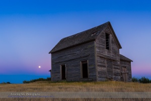 The rising almost-Full Moon, a “Blue Moon” of July 30, 2015, rising behind a rustic old farmhouse near Bow Island, Alberta. The Moon sits in the pibk Belt of Venus with the blue shadow of the Earth below. This is a single frame from a 600-frame time-lapse sequence, taken with the Canon 6D and 16-35mm lens.