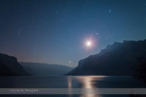 A trio of Perseid meteors shoot at left in the pre-dawn sky over Lake Minnewanka in Banff National Park. The overexposed waning crescent Moon shines between Venus (below) and Jupiter (above), with Jupiter near the Hyades and below the Pleiades in Taurus. Taken the morning of Sunday, August 12, 2012 with the Canon 5D MkII and 24mm Canon L-series lens. This is a composite of three exposures, one for each meteor, each for 40 seconds at ISO 2000 and f/5. Landscape is from one image, two other meteors from two other frames layered in and registered in the correct position in the base layer.