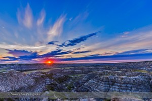 Sunset on August 1, 2015 at the Horsethief Canyon Viewpoint overlooking the Red Deer River, north of Drumheller, Alberta, on the Dinosaur Trail scenic drive. The name comes from the pioneer days when horses would get lost in the Badlands here and then re-emerge found, but with a new brand on them. The region is home to rich deposits of late Cretaceous dinosaur fossils. Just south of here is the world class Royal Tyrrell Museum, a centre of research into dinosaurs and prehistoric life.  This is a single-exposure frame (not HDR) from a 300-frame time-lapse sequence, with the Canon 6D and 16-35mm lens.
