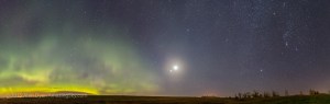 A panorama of the pre-dawn sky on October 8, 2015, with a sky full of wonders: โข the Northern Lights, or aurora โข The Big Dipper above the aurora, somewhat distorted by the panorama projection โข at centre, a conjunction and line-up of planets, with from bottom to top: Jupiter, Mars and Venus, with the bright waning crescent Moon beside Venus at top, and also beside the star Regulus in Leo โข The Beehive star cluster well above the planet grouping โข Orion and Canis Major in the winter sky at right with the Milky Way. I shot this from home, using the Canon 6D and 24mm lens on a fixed tripoid (no tracking), for 7 segments, each a 30-second exposure at f/2.2 and at ISO 1250. Stitched in Photoshop.