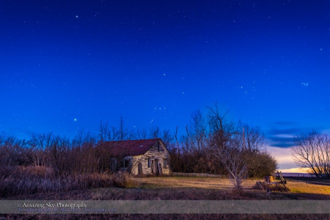 Orion and the winter constellations setting over the old Farmhouse at home, in the dawn twilight on the morning of November 14, 2015. Canis Major and Sirius are at left; Taurus and Aldebaran and the Pleiades are at right. Procyon is at upper left.  This is a stack of 4 x 20 second exposoures for the ground to smooth noise and one 20-second exposure for the sky, all with the Nikon D810a at ISO 1600 and 14-24mm Nikkor zoom lens at f/2.8.