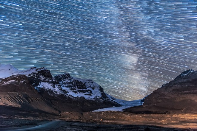 Stars setting in trails over the Athabasca Glacier and Columbia Icefields, Sept 14, 2014. The Milky Way is trailed at right. This is a stack of 100 exposures, composited with Advanced Stacker Plus actions in Photoshop, with the ground coming from a subset stack of 8 images to reduce noise. Each exposure, taken as part of a time-lapse sequence, was 45 seconds at f/2.8 with the 16-35mm lens at 23mm and Canon 6D at ISO 4000.