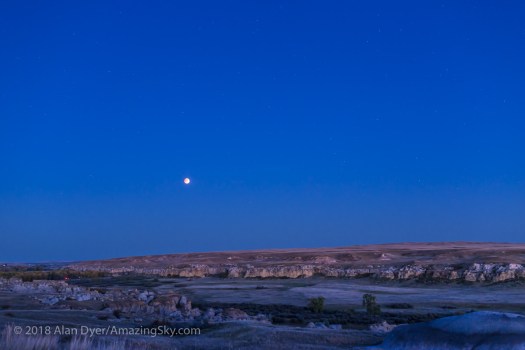 Eclipsed Moon over Writing on Stone